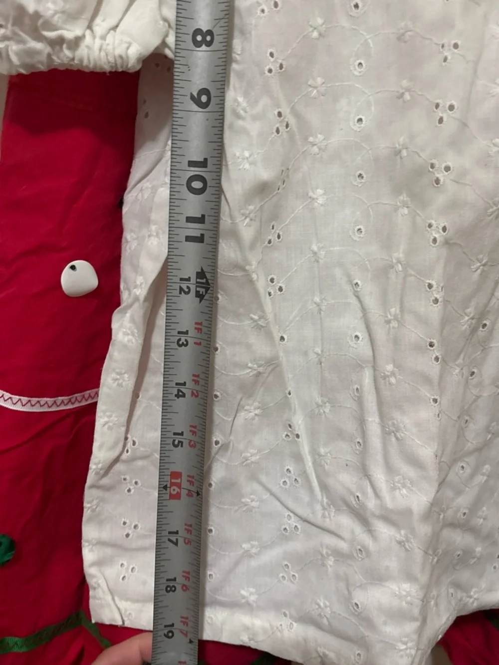 Folclórico Red skirt with white polka dots and green trim, with a white top and